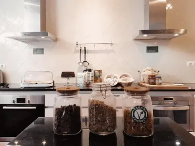 a kitchen with two glass jars filled with food at Porto Spot Hostel in Porto