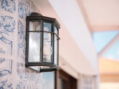 a lantern hanging on a wall at OPORTO GUEST Cedofeita Terrace in Porto