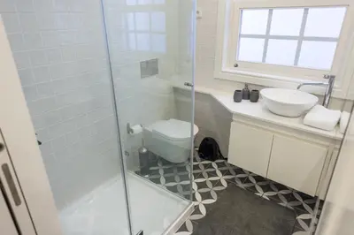 a bathroom with a toilet and a sink at São Bento Golden Flat in Porto