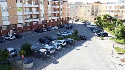 an aerial view of a parking lot with cars parked at Modern and Cozy Apartment in Vila Nova de Gaia