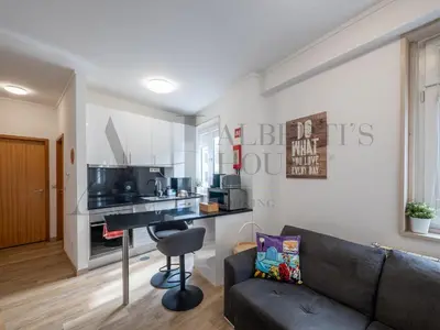 a living room with a couch and a table at Alberti's House Oporto Central Apartment in Porto