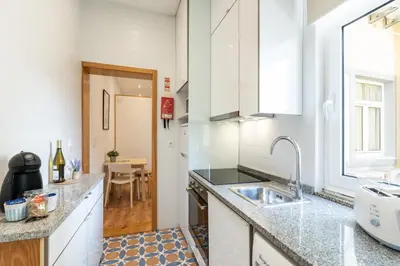 a house with a swimming pool with a table and chairs at 733 Costa Cabral Metro Residence in Porto