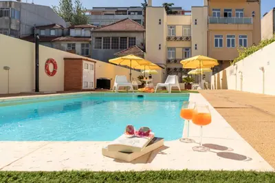a room with a bed and a couch at 731 Costa Cabral Metro Residence in Porto