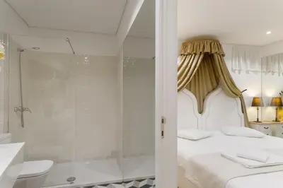 a bath tub in a bathroom with a garden at Oporto Vintage Apartment in Porto