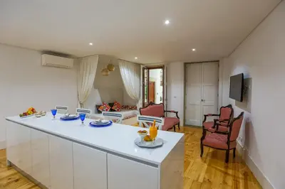 a bathroom with a bath tub with a shower curtain at Oporto Vintage Apartment in Porto