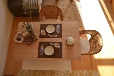 a wooden table with chairs and a tableasteryasteryasteryasteryasteryasteryasteryastery at Wood Loft by RDC in Porto