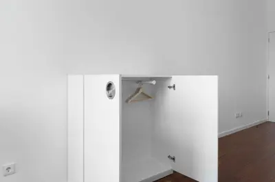 a room with white walls and a wooden floor at Goabio apartments 2 river view in Porto