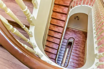 an overhead view of a spiral staircase in a building at Santa Clara Porto in Porto
