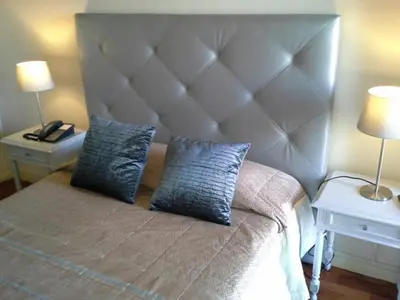 a bedroom with a large bed with two night stands at Santa Clara Porto in Porto