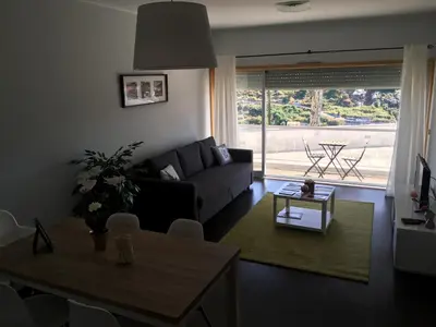 a living room with a couch and a table at Porta do Sol in Porto