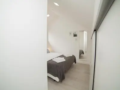 a bedroom with a bed and a mirror at OPORTO GUEST Amparo Dollhouse in Porto