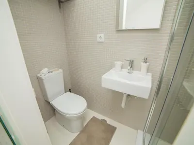 a bathroom with a toilet and a sink at OPORTO GUEST Amparo Dollhouse in Porto