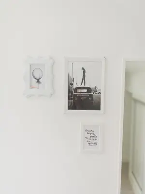 a group of pictures hanging on a wall at OPORTO GUEST Amparo Dollhouse in Porto