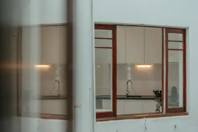 a bathroom with two sinks and two mirrors at Baixa24 - Downtown Bliss w/ Amazing Natural Light in Porto