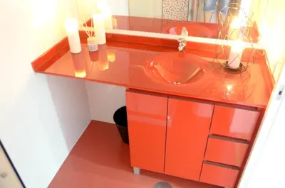 a bathroom with a red sink and a mirror at Porto Smart Apartments - Downtown in Porto