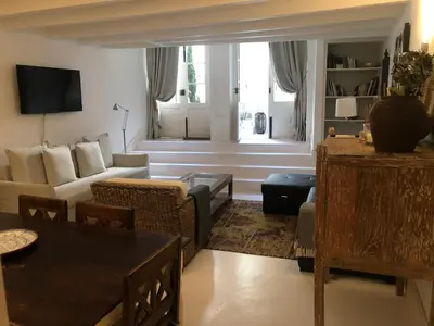 a living room with a couch and a table at PortoSense Almada in Porto