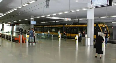 a group of people standing in a train station at Green Suite in Porto