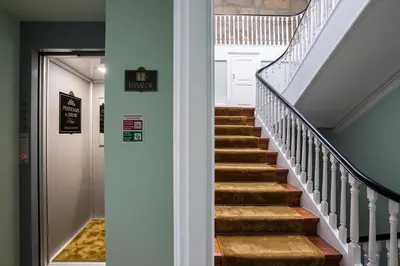a stairway leading to the basement of a house at Predicados do Douro Palace in Porto