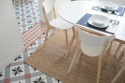 a dining room table with two white chairs and a table with a plate at Sleep in Centre Downtown in Porto