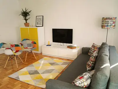 a living room with a couch and a flat screen tv at Always Porto in Vila Nova de Gaia