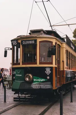a trolley car is on the tracks at Budget-Friendly Studio with Balcony in Rosario in Porto