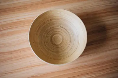 a bowl sitting on top of a wooden table at Budget-Friendly Studio with Balcony in Rosario in Porto