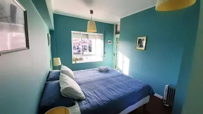 a blue bedroom with a bed and a window at Porto Downtown Main Str (S.Catarina) + Free Park in Porto