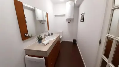 a bathroom with a sink and a mirror at Porto Downtown Main Str (S.Catarina) + Free Park in Porto