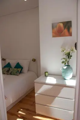 a living room with a couch and a table at OportoView Alegria Apartment in Porto