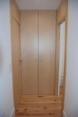 a room with a large closet with wooden floors at OportoView Alegria Apartment in Porto