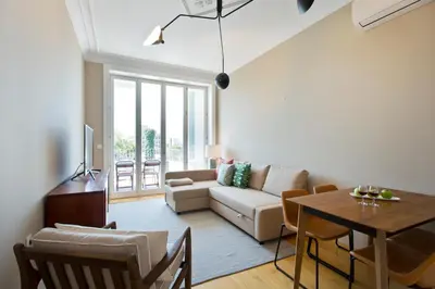 a living room with a couch and a table at Soulmade Porto in Porto