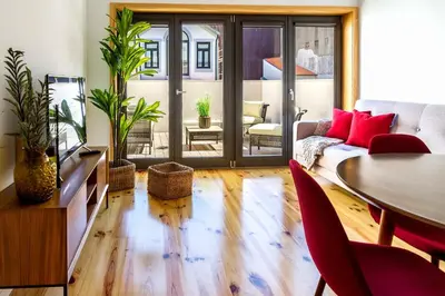 a living room with a couch and a table at Formosa 178 by Guestify in Porto