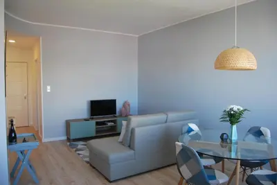 a living room with a couch and a table at Bessa Apartment in Porto