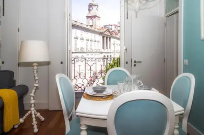 a dining room with a table and chairs and a window at Liiiving in Porto | Ribeira Boutique Apartment in Porto