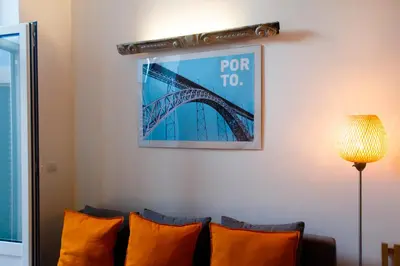a bedroom with a large bed with white pillows at DL 205 in Porto