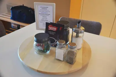 a tray with jars and bottles on a table at Spot Family Apartments in Porto