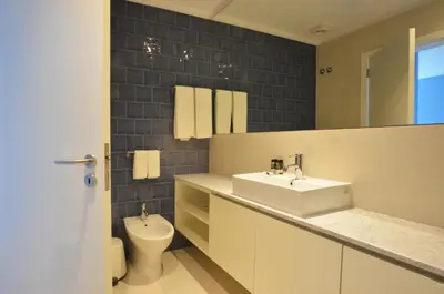 a bathroom with a sink and a toilet at Spot Family Apartments in Porto