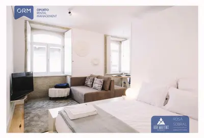 a living room with a bed and a couch at ORM - Almada Apartments in Porto