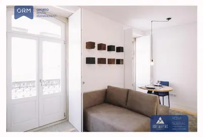 a living room with a couch and a door at ORM - Almada Apartments in Porto
