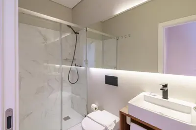 a bathroom with a shower and a sink at N Apartments - Bolhão in Porto