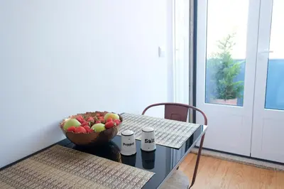 a bowl of fruit on a table with a bowl of apples at Porto Duke's House in Porto