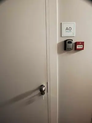 a door with a alarm clock and a toaster on it at Panorama Apartments Ribeira Porto in Porto