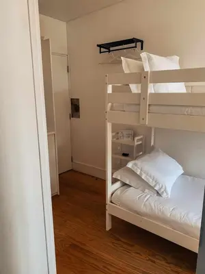 a small room with a bunk bed and a bunk bed at Panorama Apartments Ribeira Porto in Porto