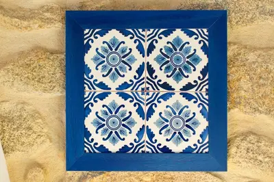 a blue and white tile in a blue frame at Ribeira Stay Apartments in Porto