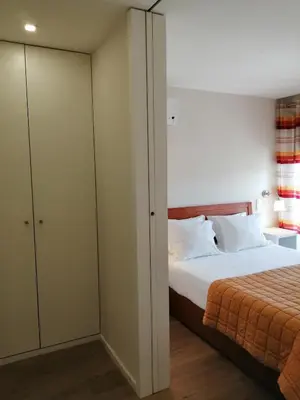 a bedroom with a bed and a closet at BC Porto Downtown Apartment in Porto