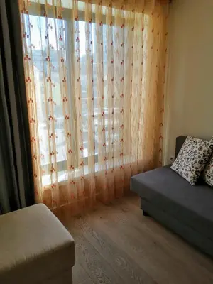 a living room with a couch and a window at BC Porto Downtown Apartment in Porto