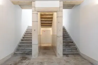 an empty hallway with stairs and a door at AmaOporto - St. Ildefonso in Porto