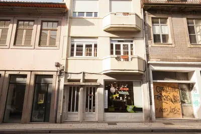 a store front of a building on a city street at ML Formosa Deluxe Rooms in Porto