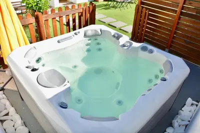 a jacuzzi tub sitting on a patio at Porto Garden Villas | Downtown in Vila Nova de Gaia