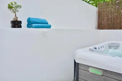 a bathroom with a bath tub with a sink at Porto Garden Villas | Downtown in Vila Nova de Gaia